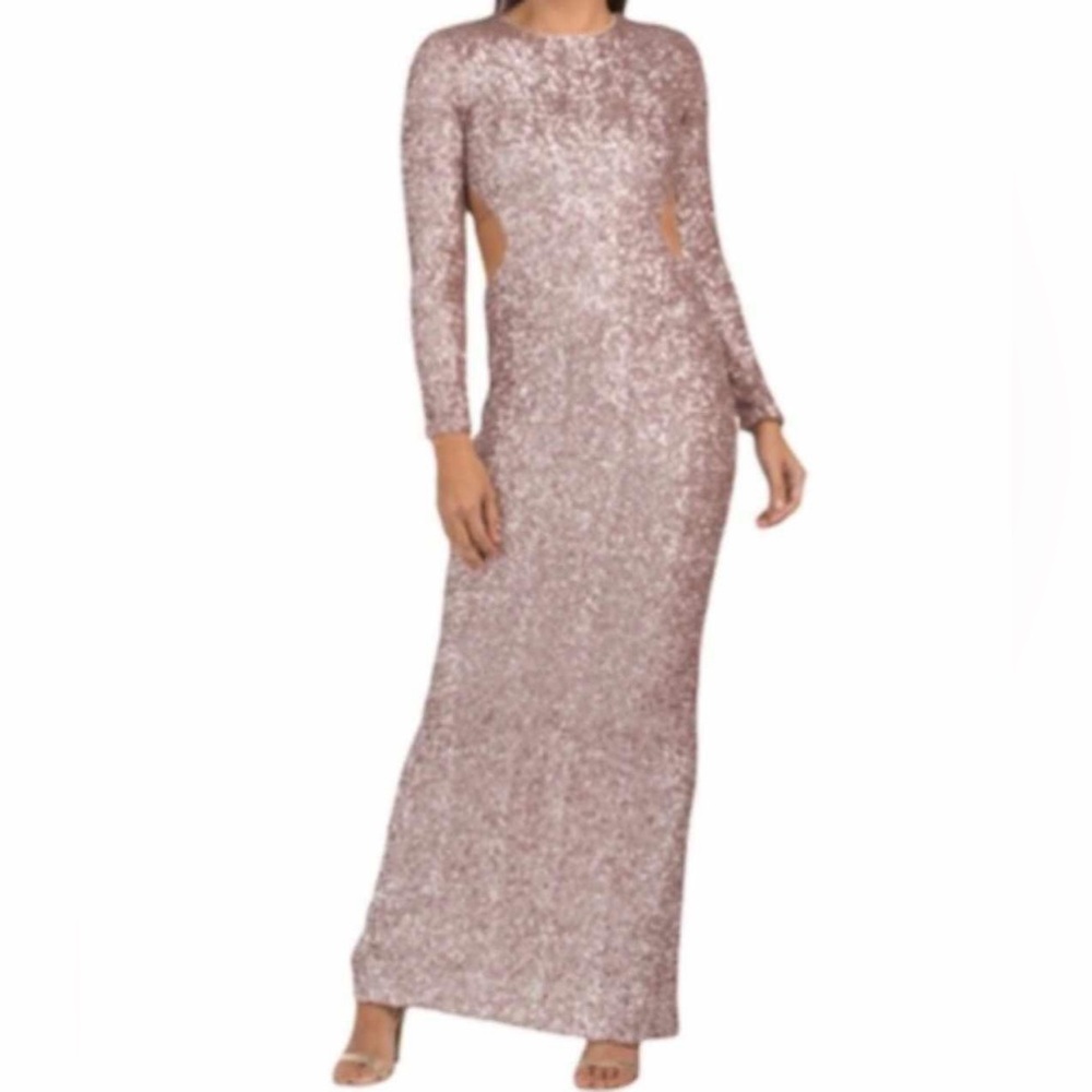 A stunning long sleeve and sequence maxi dress with cutouts on the side.